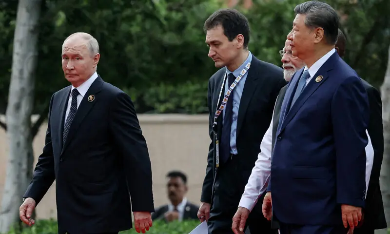 Chinese President Xi Jinping and his Russian counterpart Vladimir Putin walk together during the BRICS Summit in New Delhi.—AFP Chinese President Xi Jinping and his Russian counterpart Vladimir Putin walk together during the BRICS Summit in New Delhi.—AFP