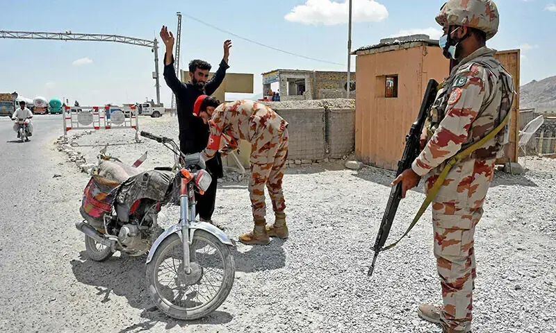 A paramilitary ranger frisks a motorcyclist at a checkpoint a day after attacks by terrorists on the outskirts of Quetta on August 27, 2024. — AFP/File A paramilitary ranger frisks a motorcyclist at a checkpoint a day after attacks by terrorists on the outskirts of Quetta on August 27, 2024. — AFP/File