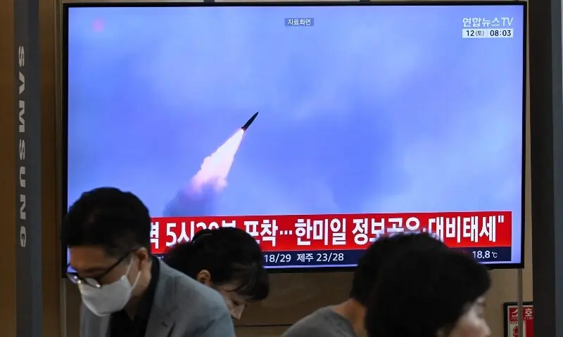 People sit near a television screen showing a news broadcast with file footage of a North Korean missile test, at a train station in Seoul on September 12, 2026. —AFP People sit near a television screen showing a news broadcast with file footage of a North Korean missile test, at a train station in Seoul on September 12, 2026. —AFP