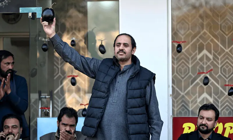 This photograph taken on January 26, 2024 shows PTI’s Aamir Mughal (C) holding his electoral symbol ‘eggplant’ during an election campaign meeting in Islamabad. — AFP/File This photograph taken on January 26, 2024 shows PTI’s Aamir Mughal (C) holding his electoral symbol ‘eggplant’ during an election campaign meeting in Islamabad. — AFP/File