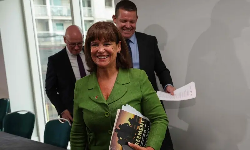 Mary Lou McDonald (front), president of Irish Republicans Sinn Fein leaves with Rhun ap Iorwerth (back R) of Plaid Cymru in Wales and Scottish Nationalist Party (SNP) leader John Swinney (back L) at the end of a press conference following a meeting between the leaders of the main Scottish, Northern Irish and Welsh parties in Cardiff, Wales on September 14, 2026. &mdash; AFP