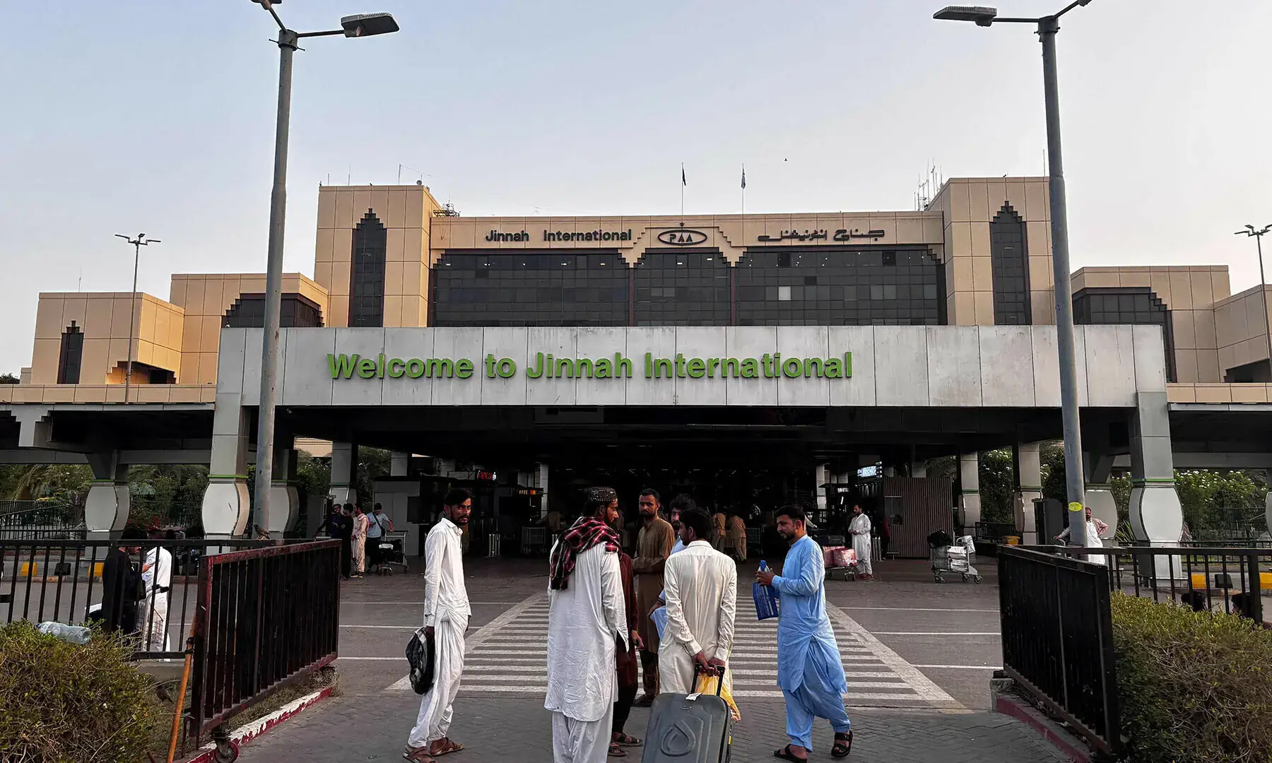 Passengers wait outside at Jinnah International airport after all domestic and international flights were cancelled in Karachi on May 7, 2025. — AFP/File Passengers wait outside at Jinnah International airport after all domestic and international flights were cancelled in Karachi on May 7, 2025. — AFP/File