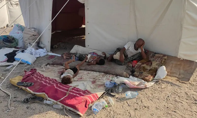 Yemenis rest outside a tent at a camp for displaced people, following clashes between Houthi fighters and Saudi-backed forces near the city of Aden.—Reuters Yemenis rest outside a tent at a camp for displaced people, following clashes between Houthi fighters and Saudi-backed forces near the city of Aden.—Reuters