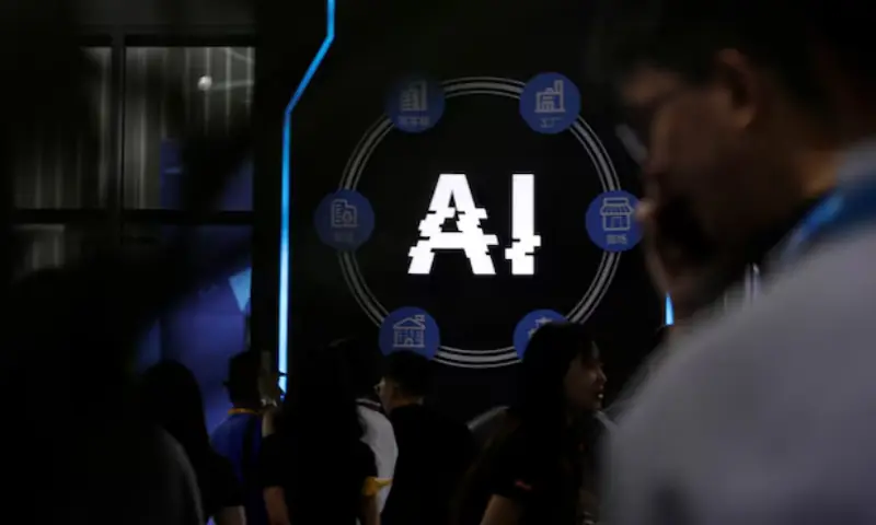 Visitors stand near a sign of artificial intelligence at an AI robot booth at Security China, an exhibition on public safety and security, in Beijing, China on June 7, 2023. &mdash; Reuters/ File