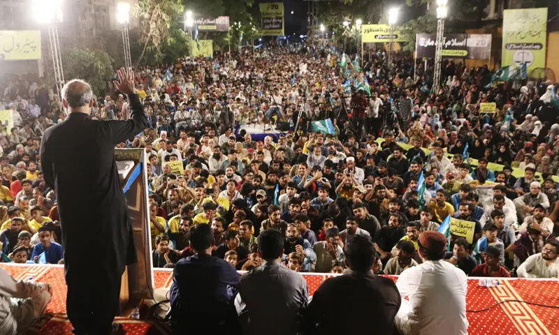Jamaat-i-Islami chief Hafiz Naeemur Rehman addresses participants of the sit-in.—Dawn Jamaat-i-Islami chief Hafiz Naeemur Rehman addresses participants of the sit-in.—Dawn