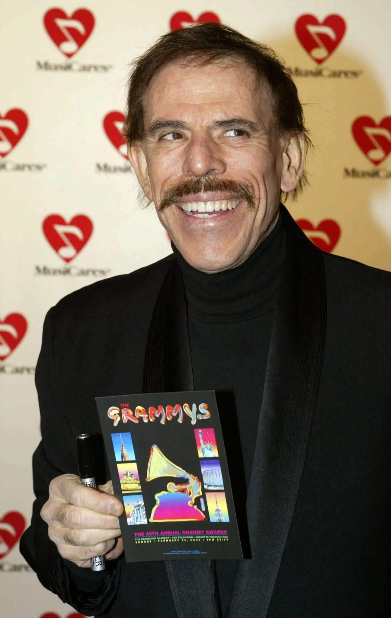 Artist Peter Max arrives as a guest at a dinner in New York, US, February 21, 2003. Photo: Reuters