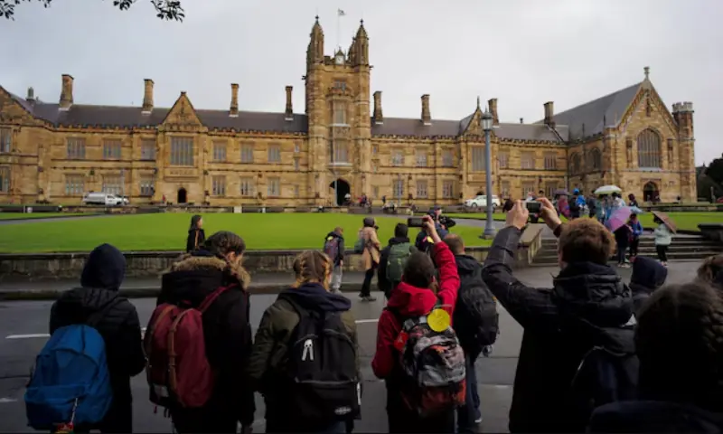 Visitors take pictures of the main building at the University of Sydney in Australia on August 5, 2016. — Reuters/ File Visitors take pictures of the main building at the University of Sydney in Australia on August 5, 2016. — Reuters/ File