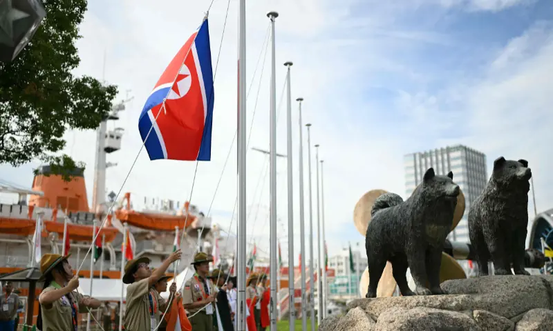 The North Korean flag is raised by scouts for the team welcome ceremony ahead of the 2026 Asian Games in Nagoya on September 18, 2026. --AFP
