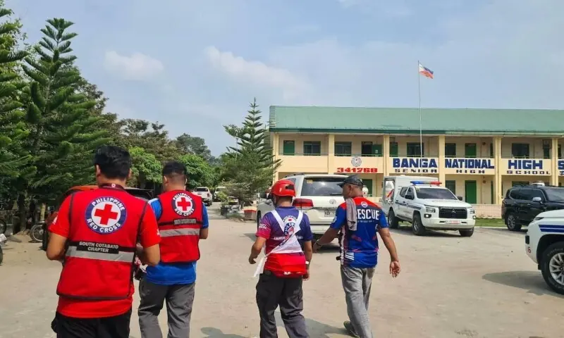 Emergency personnel walk at a site of a deadly shooting at a school in Banga, South Cotabato, Philippines, on September 18, 2026. &mdash; Reuters
