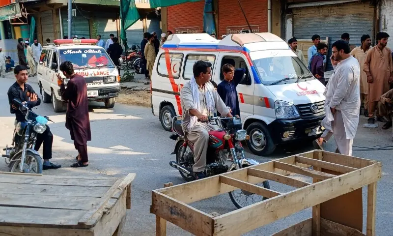 Ambulances and residents gather on a street leading to a police facility following a suicide attack in Kohat, Pakistan, on September 18, 2026. — Reuters Ambulances and residents gather on a street leading to a police facility following a suicide attack in Kohat, Pakistan, on September 18, 2026. — Reuters