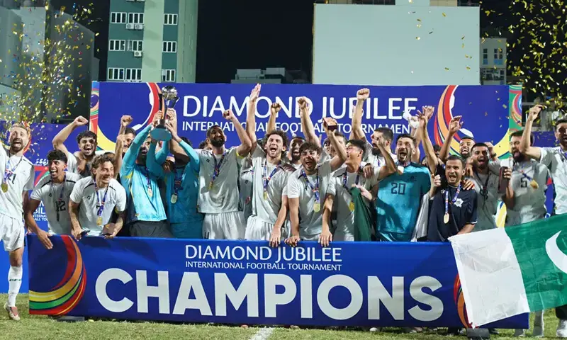 PAKISTAN players celebrate with the Diamond Jubilee International Football Tournament trophy after beating Afghanistan in the final at the National Stadium on Wednesday. &mdash;Courtesy PFF/File
