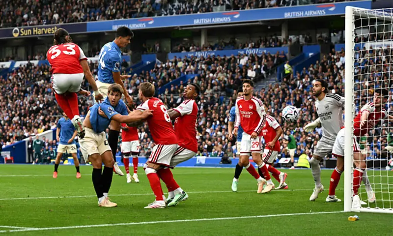 BRIGHTON: Chema Andres (top R) of Brighton and Hove Albion heads to score against Arsenal during their Premier League match at the American Express Community Stadium on Saturday.—AFP BRIGHTON: Chema Andres (top R) of Brighton and Hove Albion heads to score against Arsenal during their Premier League match at the American Express Community Stadium on Saturday.—AFP
