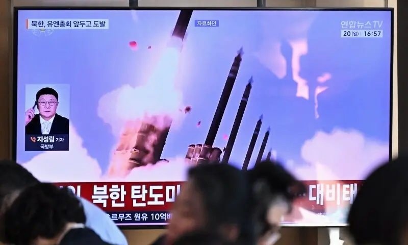 People sit near a television screen showing a news broadcast with file footage of a North Korean missile test, at a train station in Seoul on September 20, 2026. —AFP People sit near a television screen showing a news broadcast with file footage of a North Korean missile test, at a train station in Seoul on September 20, 2026. —AFP