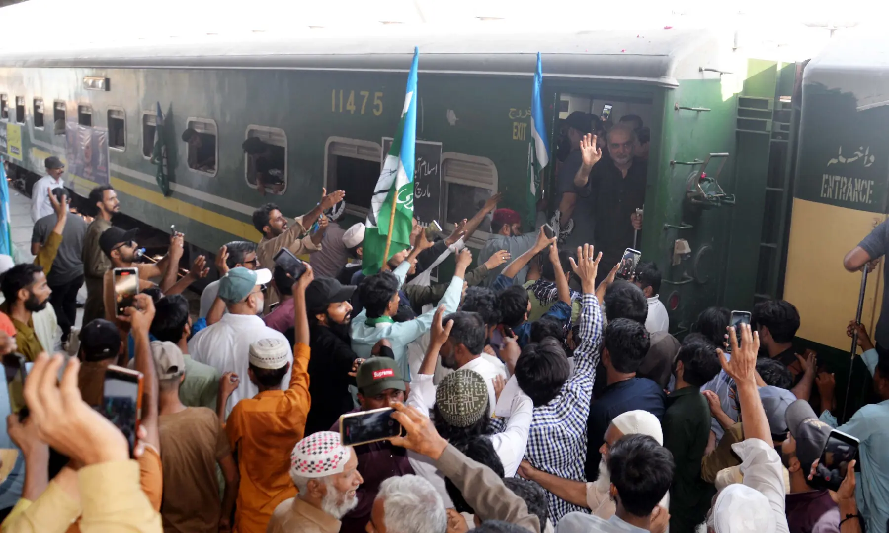 JI chief Hafiz Naeemur Rehman waves to supporters at Hyderabad Railway Station on Sept 20, 2026. &mdash; Umair Ali