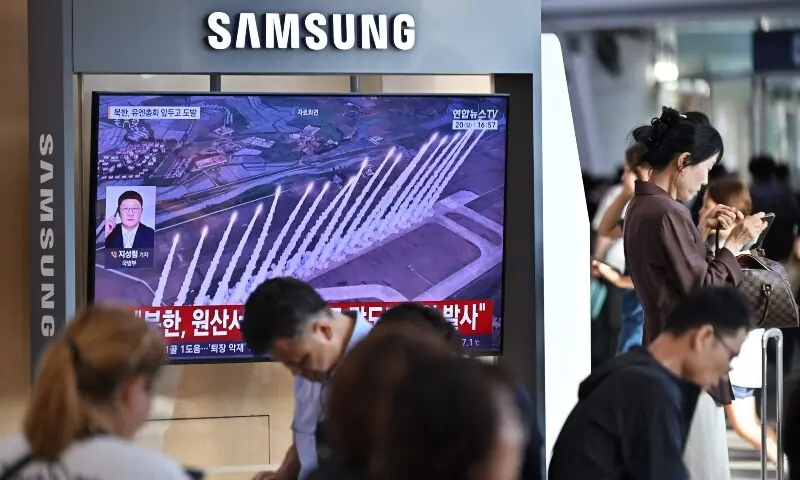 People sit near a television screen showing a news broadcast with file footage of a North Korean missile test, at a train station in Seoul on September 20, 2026. —AFP People sit near a television screen showing a news broadcast with file footage of a North Korean missile test, at a train station in Seoul on September 20, 2026. —AFP