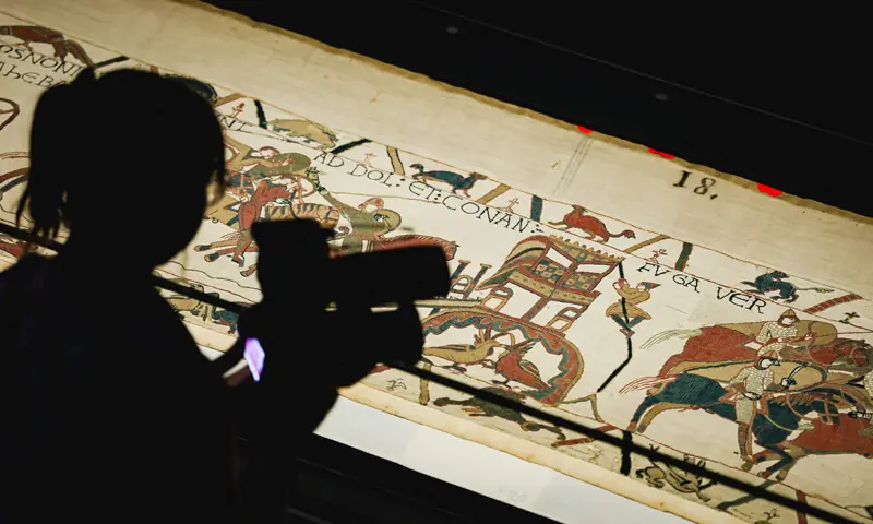 A CAMERA operator films a section of the Bayeux Tapestry at the British Museum.—AFP/file A CAMERA operator films a section of the Bayeux Tapestry at the British Museum.—AFP/file
