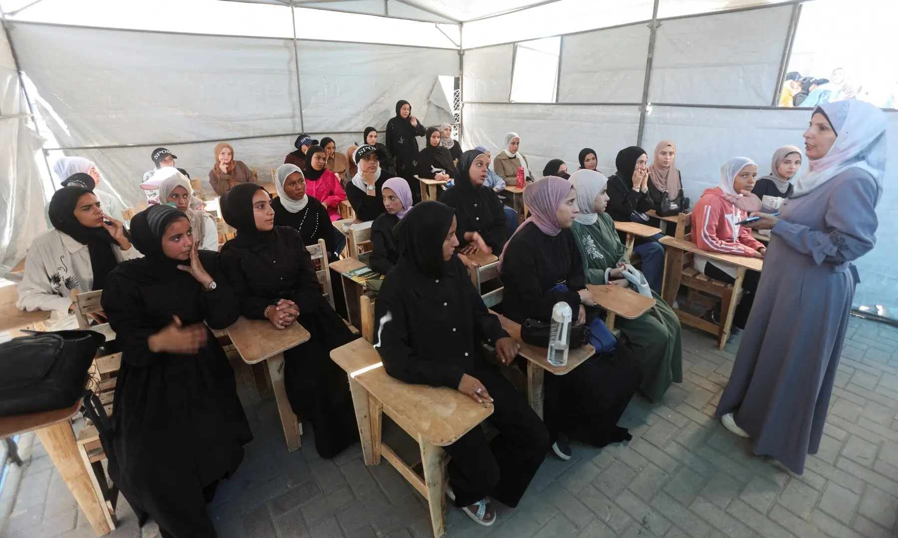 A Palestinian teacher conducts a lesson for displaced Palestinian students, including Samar Abu Salmi, 15, inside a tent classroom in Khan Younis, in the southern Gaza Strip on September 20, 2026. —Reuters