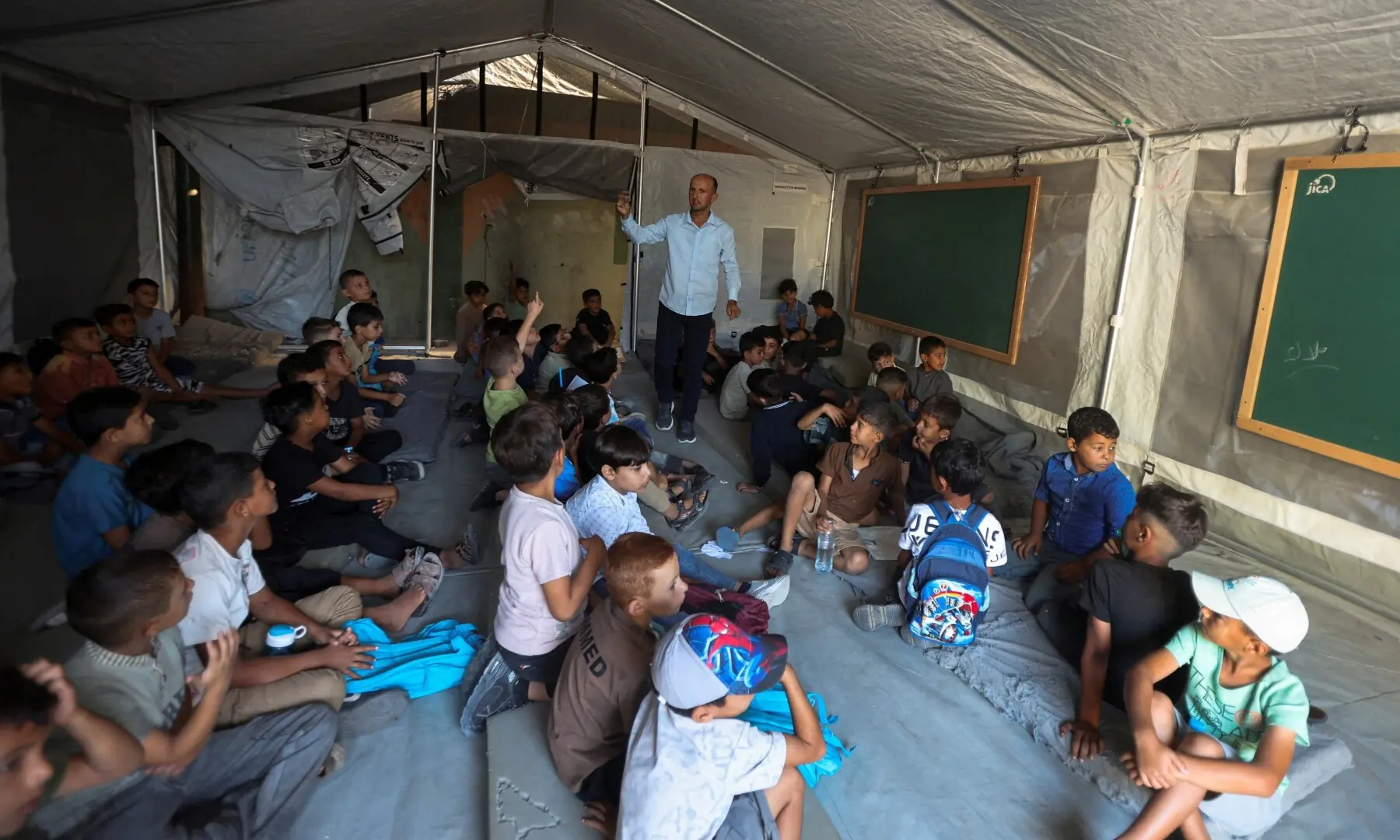Palestinian students attend their first day of the new school year inside a tent classroom at a school in Khan Younis, in the southern Gaza Strip on September 19, 2026. —Reuters