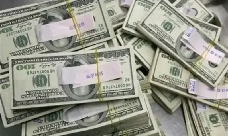 A file photo of stacks of US currency. &mdash; Reuters/File