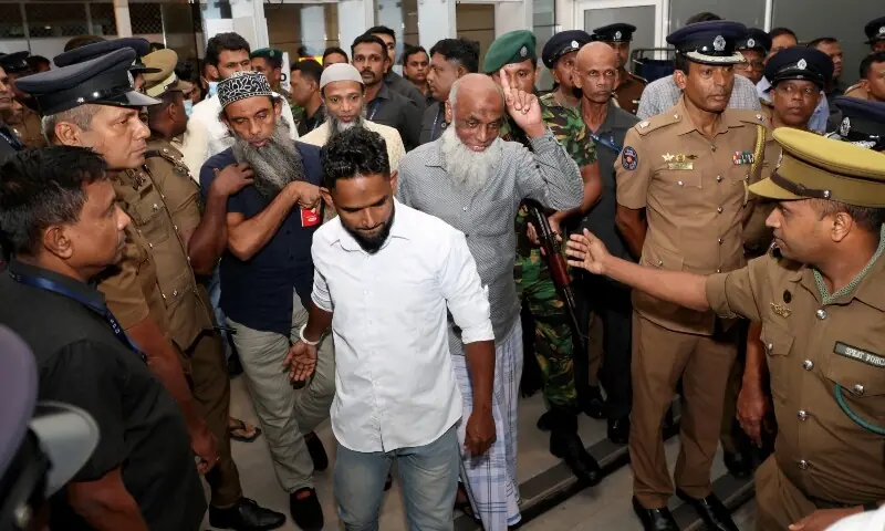 Men convicted over the 2019 Easter bombings that killed 279 people are escorted by police officers in Colombo, Sri Lanka, September 23, 2026. &mdash;Reuters
