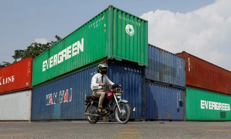 A man rides a motorcycle past shipping containers used to block the area ahead of a planned march by the PTI demanding Imran Khan's release in Islamabad on September 23, 2026. — Reuters A man rides a motorcycle past shipping containers used to block the area ahead of a planned march by the PTI demanding Imran Khan's release in Islamabad on September 23, 2026. — Reuters
