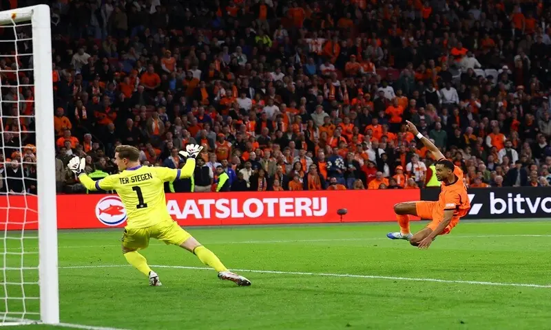 Netherlands' Cody Gakpo scores past Germany goalkeeper Marc-Andre ter Stegen during their UEFA Nations League (League A, Group A2) match at the Johan Cruijff Arena in Amsterdam on September 24, 2026. &mdash;Reuters