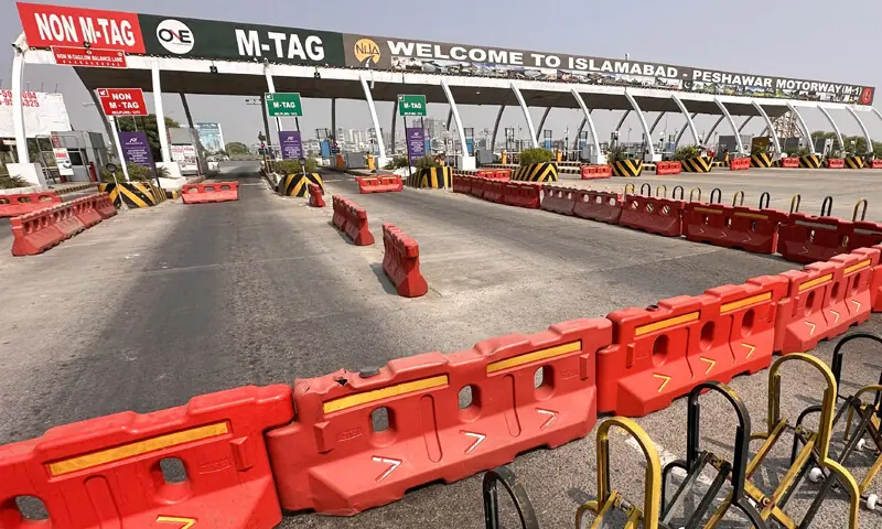 THE entrance to the M1 Motorway is blocked with barricades, as part of measures taken by the capital administration to prevent the PTI from staging its protest march on the capital.&mdash;Mohammad Asim