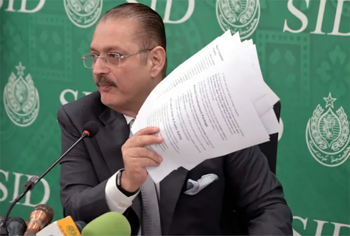 Sindh Senior Minister Sharjeel Inam Memon shows documents during a press conference at the Karachi Press Club. —PPI Sindh Senior Minister Sharjeel Inam Memon shows documents during a press conference at the Karachi Press Club. —PPI