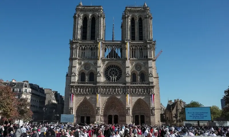 People gather outside the Notre-Dame de Paris Cathedral in Paris ahead of the arrival of Pope Leo XIV to celebrate Vespers, as part of his four-day apostolic journey to France, on September 25, 2026. — Reuters