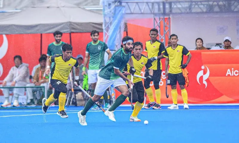 Players in action between the Asian Games group stage hockey match between Pakistan and Malaysia at the at the Gifu Prefectural Green Stadium in Kakamigahara, Japan on September 26, 2026.--Courtesy Asian Hockey Federation Players in action between the Asian Games group stage hockey match between Pakistan and Malaysia at the at the Gifu Prefectural Green Stadium in Kakamigahara, Japan on September 26, 2026.--Courtesy Asian Hockey Federation