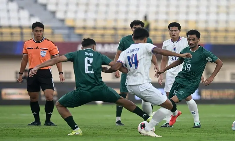 Pakistan's Abdullah Shah (L) vies for the ball with Thailand's Teerasak Poeiphimai during their FIFA Asean Cup Division 1, Group B match at the Si Jalak Harupat Stadium in Bandung, Indonesia, on Saturday. —Courtesy PFF Pakistan's Abdullah Shah (L) vies for the ball with Thailand's Teerasak Poeiphimai during their FIFA Asean Cup Division 1, Group B match at the Si Jalak Harupat Stadium in Bandung, Indonesia, on Saturday. —Courtesy PFF