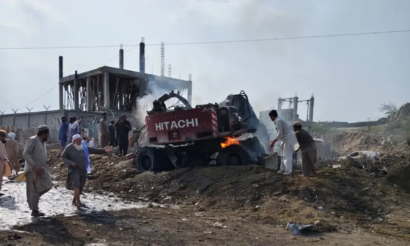 People at the site of a bomb blast targeting a police checkpost in Aman Mela, DI Khan, on Sept 26, 2026. &mdash; Rescue 1122