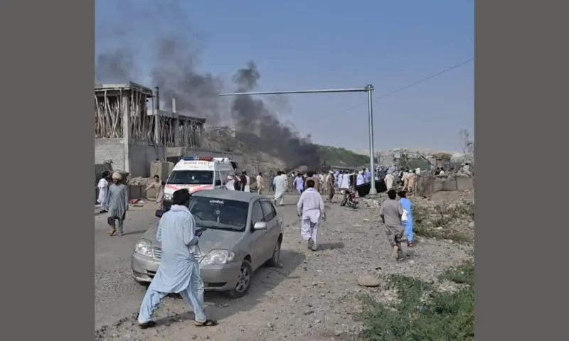 Smoke rises from the site of a bomb blast targeting a police checkpost in Aman Mela, DI Khan, on Sept 26, 2026. &mdash; via author