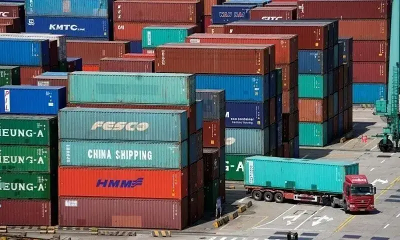 This file photo shows shipping containers at a port. — Reuters/File This file photo shows shipping containers at a port. — Reuters/File