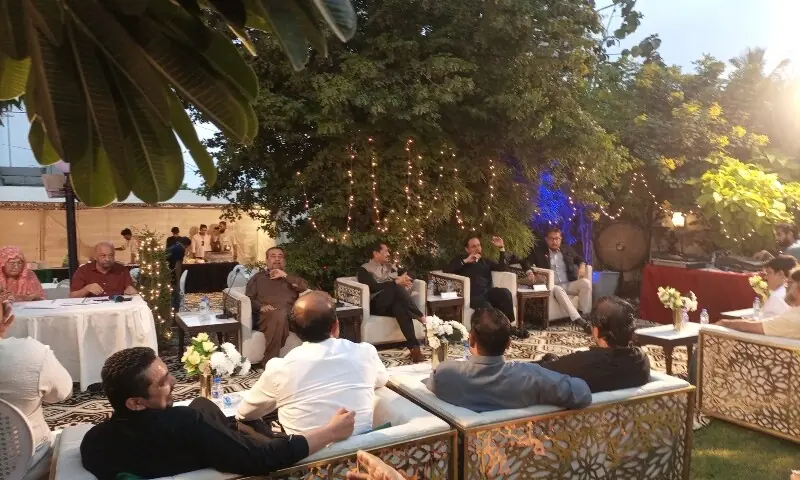 Murtaza Wahab speaks about DHA projects at the gathering on Saturday. &mdash; Photo by the writer