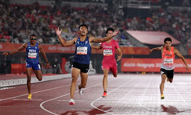 NAGOYA: Thailand&rsquo;s Puripol Boonson (front) crosses the finish line to win the Asian Games 200m final at the Paloma Mizuho Sports Park on Sunday.&mdash;Reuters