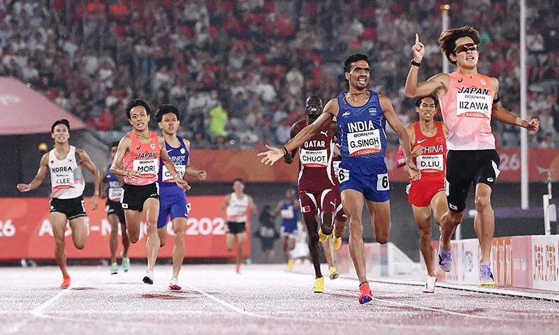 NAGOYA: Japan&rsquo;s Kazuto Iizawa celebrates after winning the 1500m final of the Asian Games at Paloma Mizuho Sports Park on Monday.&mdash;Reuters