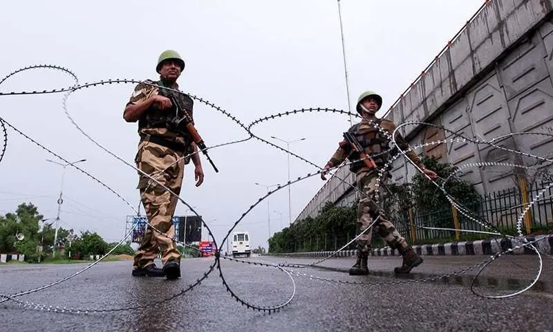 Security personnel stand guard at a roadblock in Jammu on August 7, 2019. — AFP/File Security personnel stand guard at a roadblock in Jammu on August 7, 2019. — AFP/File