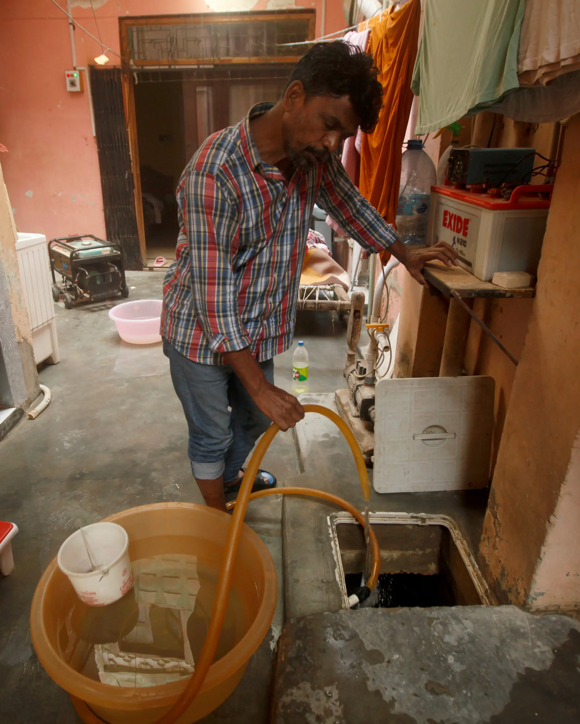  Households in Essa Nagri cluster around a central space and share underground tanks. Photo: Athar Hussain 