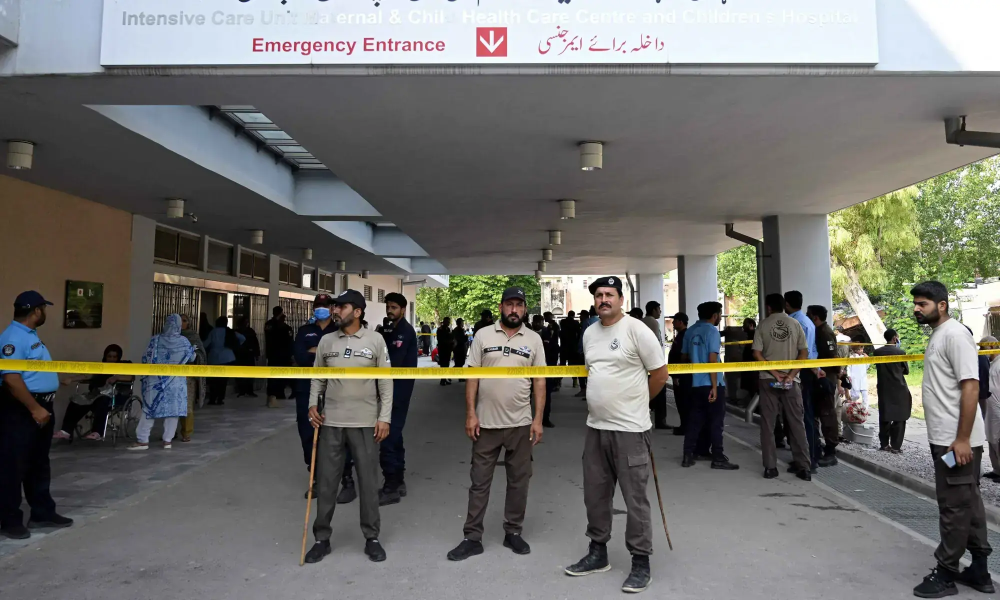 Security personnel stand guard following a fire incident outside the Mother and Child Health (MCH) ward at the Pakistan Institute of Medical Sciences Hospital in Islamabad on August 26, 2026. &mdash; AFP/File