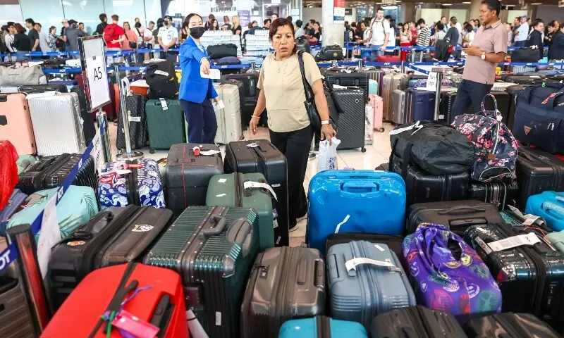 Passengers search their delayed baggage from Thai Airways flights at Suvarnabhumi International Airport, after heavy rain and flooding disrupted the airline’s ground operations, in Bangkok, Thailand, September 29, 2026. —Reuters