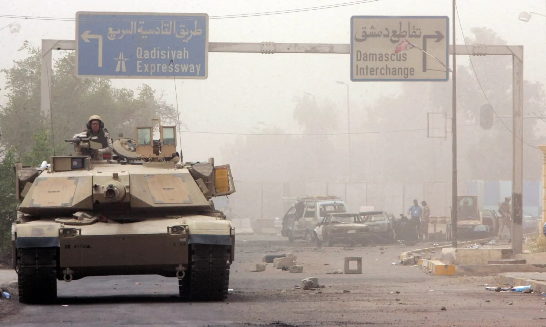 A US army tank takes up a position near the scene of a suicide bomb attack in Baghdad, Iraq on July 14, 2005. &mdash;Reuters/File