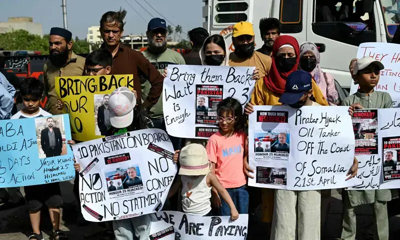 Families of Pakistani seamen held captive by Somali pirates stage a demonstration near the city port, urging the government to ensure their safe return.—AFP/File Families of Pakistani seamen held captive by Somali pirates stage a demonstration near the city port, urging the government to ensure their safe return.—AFP/File
