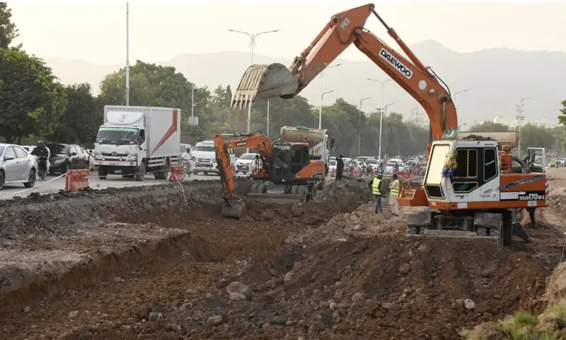Work on a diversion road continues ahead of the commencement of the Kashmir Chowk underpass project in Islamabad. — Photo by Tanveer Shahzad Work on a diversion road continues ahead of the commencement of the Kashmir Chowk underpass project in Islamabad. — Photo by Tanveer Shahzad