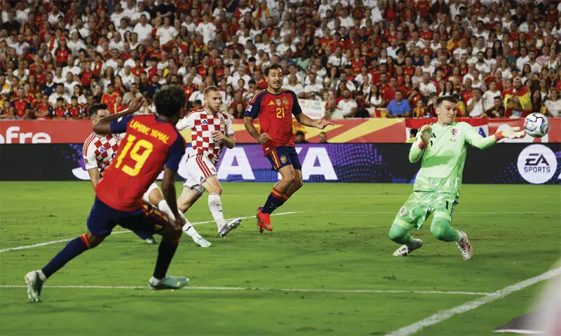 SEVILLE: Spain’s Lamine Yamal scores past Croatia goalkeeper Dominik Livakovic during their UEFA Nations League Group A3 match at the Ramon Sanchez Pizjuan Stadium.—Reuters SEVILLE: Spain’s Lamine Yamal scores past Croatia goalkeeper Dominik Livakovic during their UEFA Nations League Group A3 match at the Ramon Sanchez Pizjuan Stadium.—Reuters