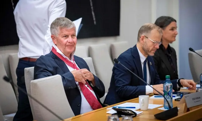 Norway’s former Minister of Climate and the Environment Erik Solheim (L) folds his tie as he attends the Storting’s Control and Constitutional Committee open hearing on the practice in the Ministry of Foreign Affairs and Jeffrey Epstein’s network in Norway, in Oslo on September 30, 2026. —AFP