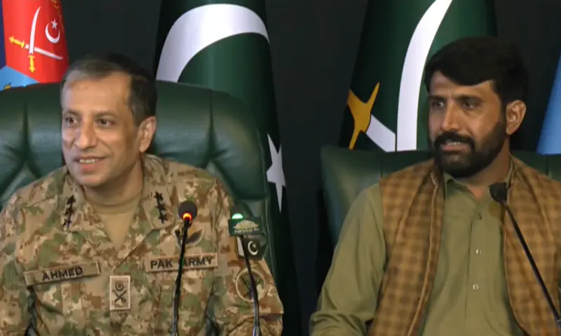 Inter-Services Public Relations Director General Lt Gen Ahmed Sharif Chaudhry, flanked by former havildar Mohammad Asif, addresses a press conference on Oct 1, 2026. &mdash; screengrab via PTV News