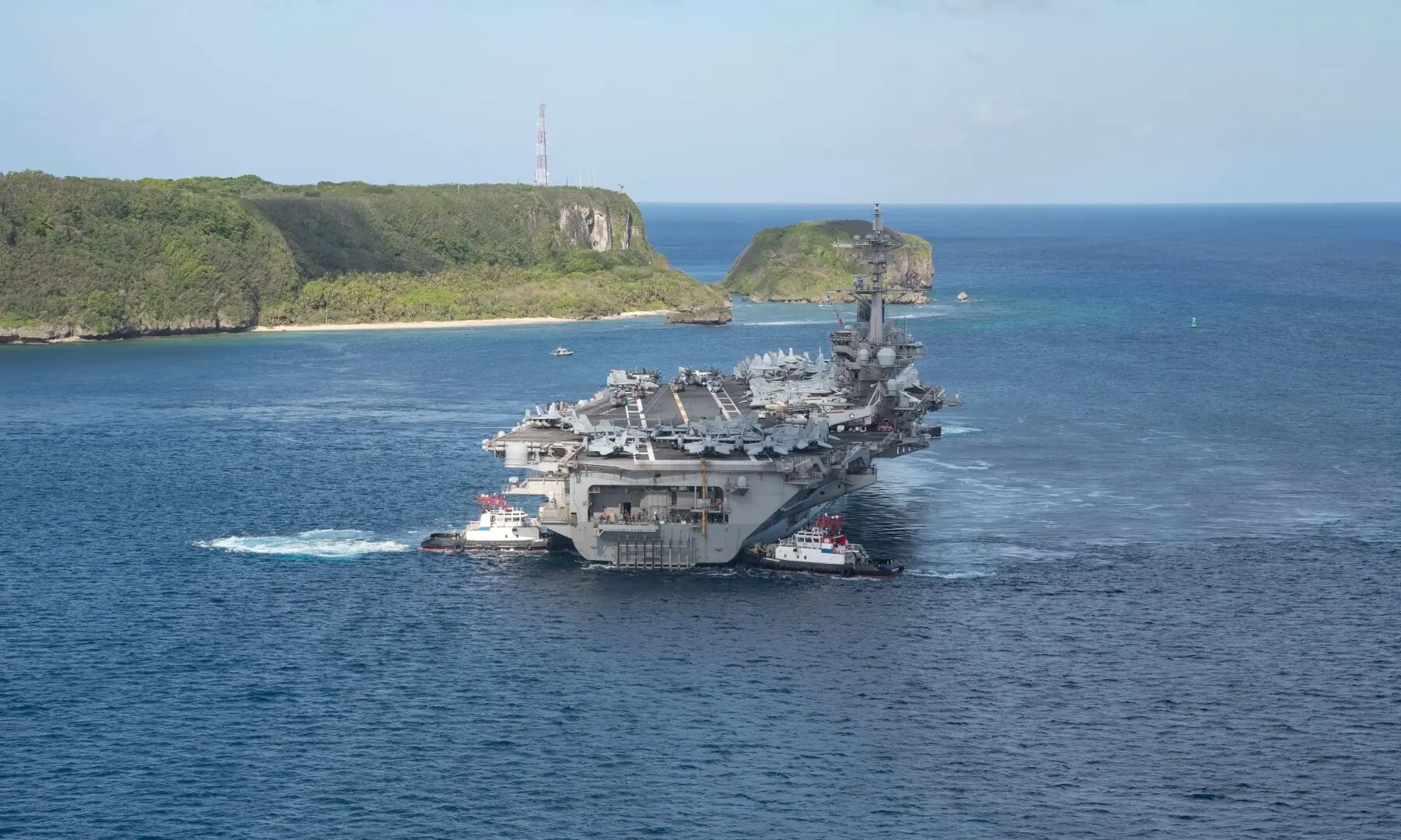 The USS Theodore Roosevelt aircraft carrier departs Guam, in this photo from May 21, 2020. — Reuters/File