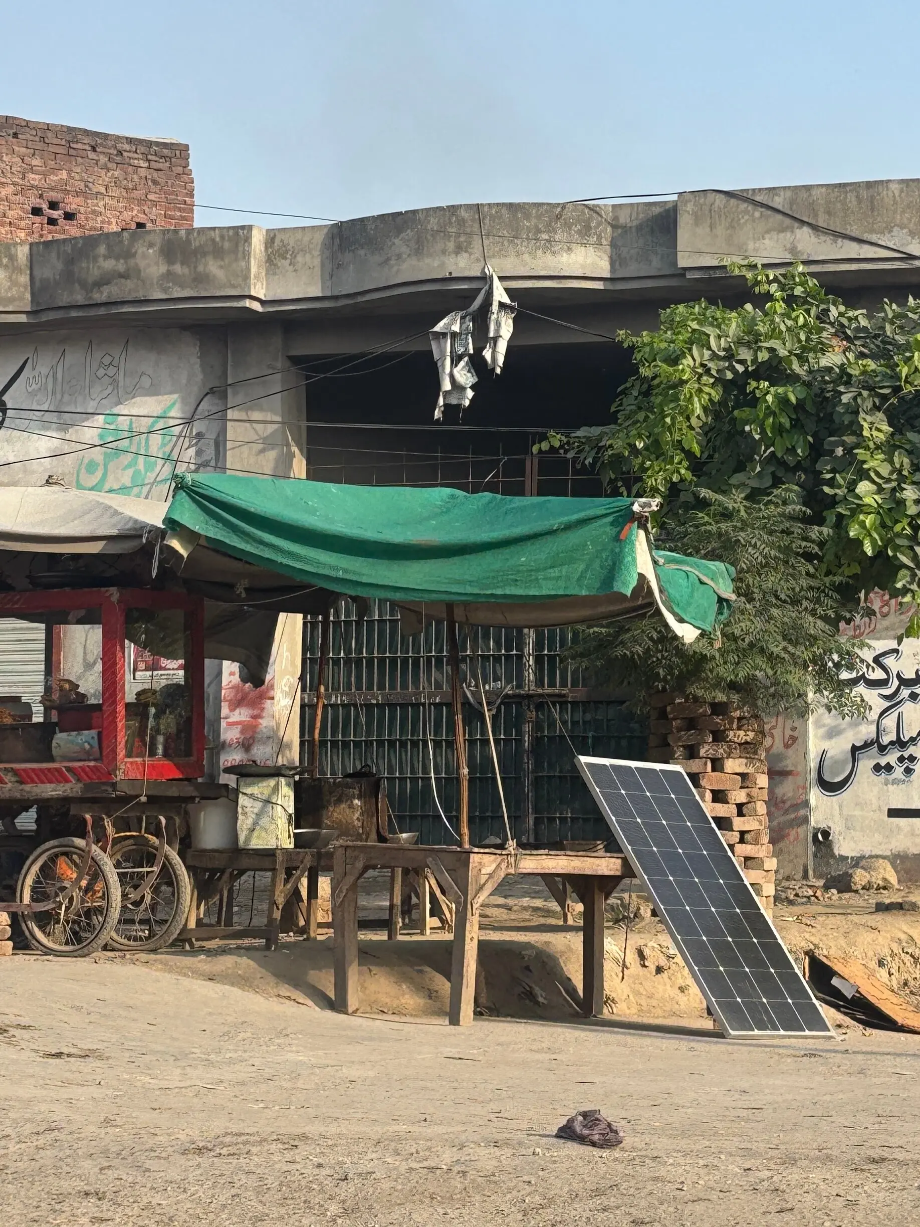  A singular panel propped up by a table in a market in Muzaffargarh 