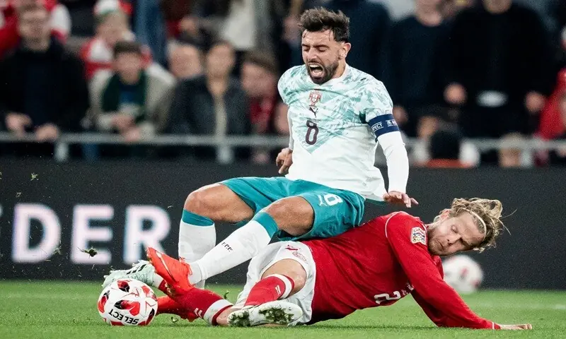 Portugal's Bruno Fernandes (L) is tackled by Denmark's Morten Hjulmand during their UEFA Nations League Group A4 match at the Parken Stadium in Copenhagen on October 1, 2026. —AFP Portugal's Bruno Fernandes (L) is tackled by Denmark's Morten Hjulmand during their UEFA Nations League Group A4 match at the Parken Stadium in Copenhagen on October 1, 2026. —AFP